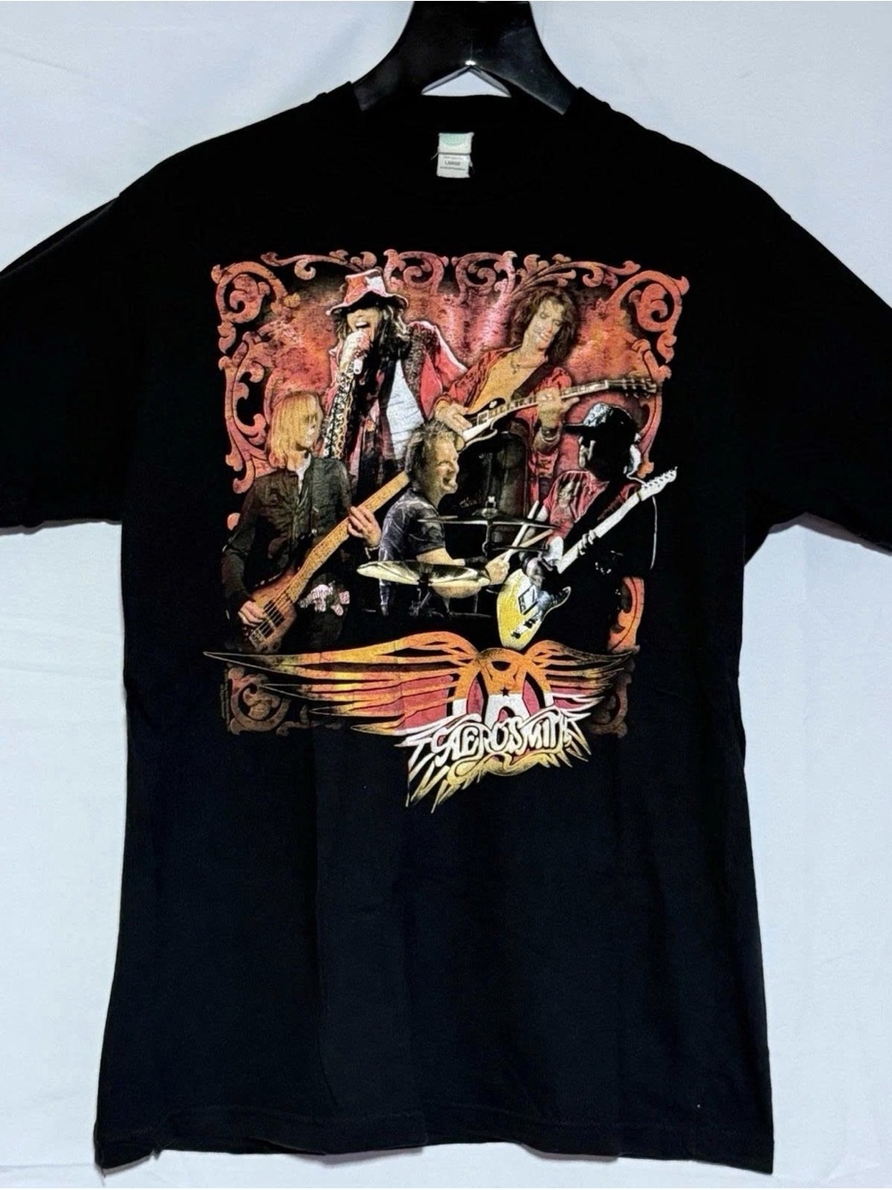 Black Tee with Aerosmith Band Graphic and Orange-Red Accents